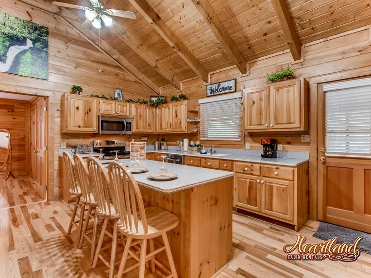 Full size kitchen with appliances and seating for 4